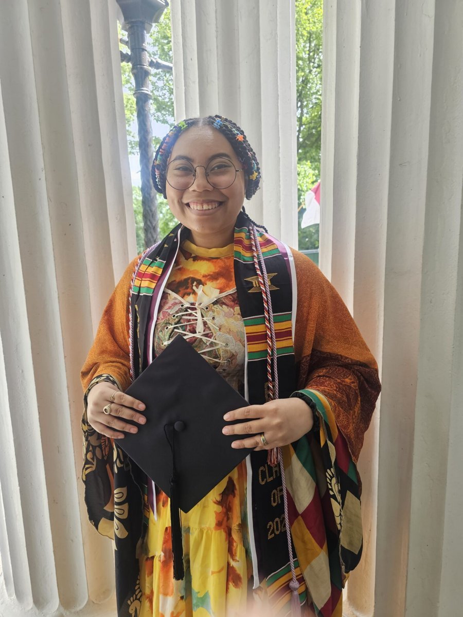Alora at Swarthmore graduation holding her cap